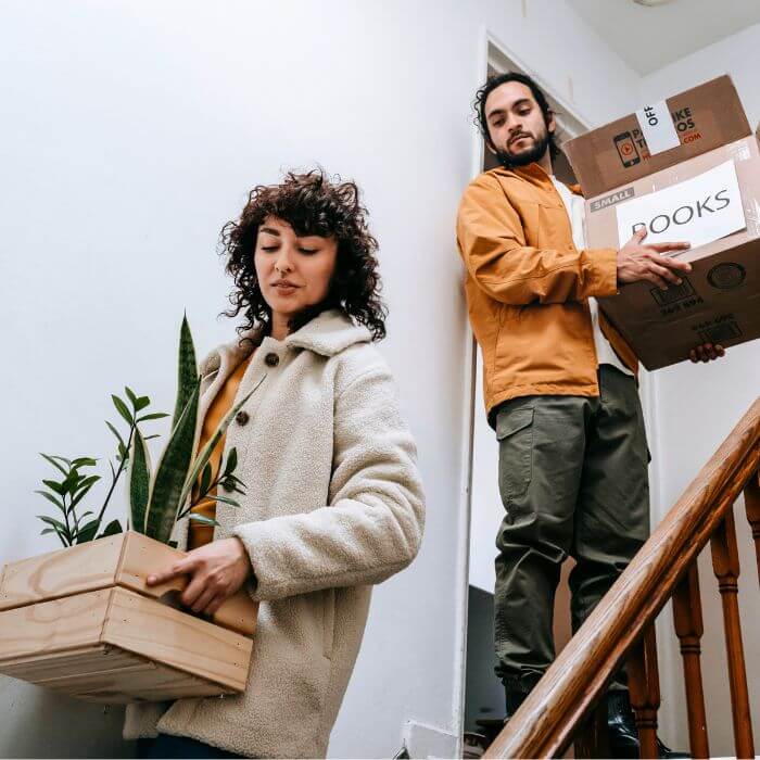 Two people with moving boxes