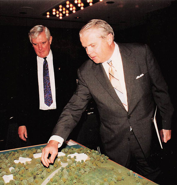 Dan Kelly reviewing model campus photo